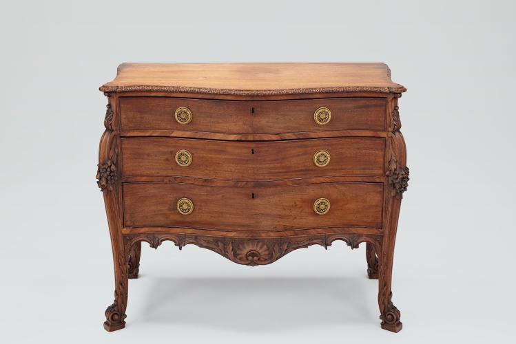 A George III Rococo Serpentine Chest by A Sergeant
